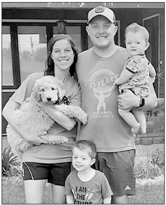 New Ainsworth Elementary Principal Ben Wright is pictured with his wife Ashlie, three-year-old son Tilden and eight-month-old son Daxton.