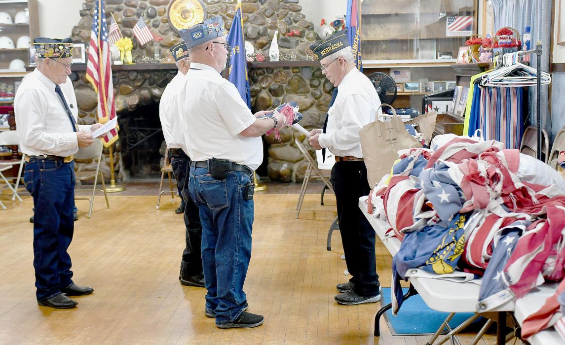 Ainsworth American Legion Post #79 conducted an Unserviceable Flag Ceremony on Flag Day, Friday, June 14th. Since the weather did not cooperate with them, the ceremony was held indoor at the Post Home. The actual burning of the unserviceable flags will take place at another time. Helping with the ceremony were Chuck Percival, Judy Walters, Charlie Kyser, Wes Luther, Mike Rudnick, Earl Brown and Arlen Uhlig.